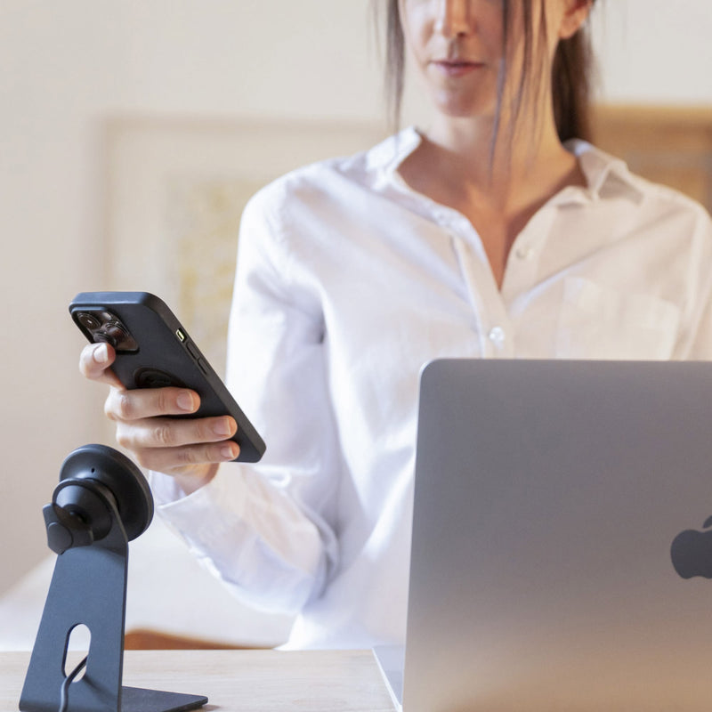 Customer Support - Picture of lady with phone and office stand